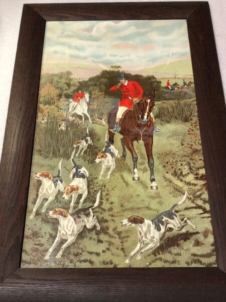 Equine Equestrian Foxhunting Lithograph1, is an antique lithograph, in it's original frame, c.1900. An active foxhunting scene, of four horses with riders, chasing the fox, in redcoats, eleven dogs and hounds. 18x22"