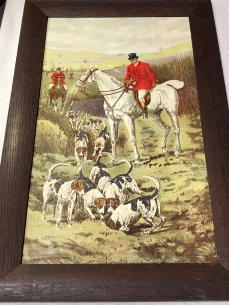 Equine Equestrian Foxhunting Lithograph2, is an antique lithograph, in it's original frame, c.1900. An active foxhunting scene, of five horses with riders, in redcoats, twelve dogs and hounds. 18x22"